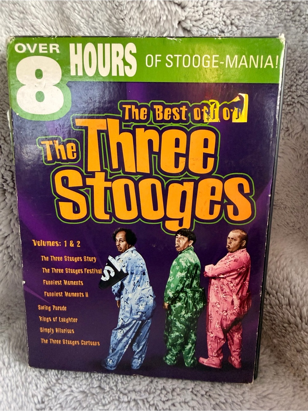 The Three Stooges: The Best of The Three Stooges - Purple & Yellow Cover